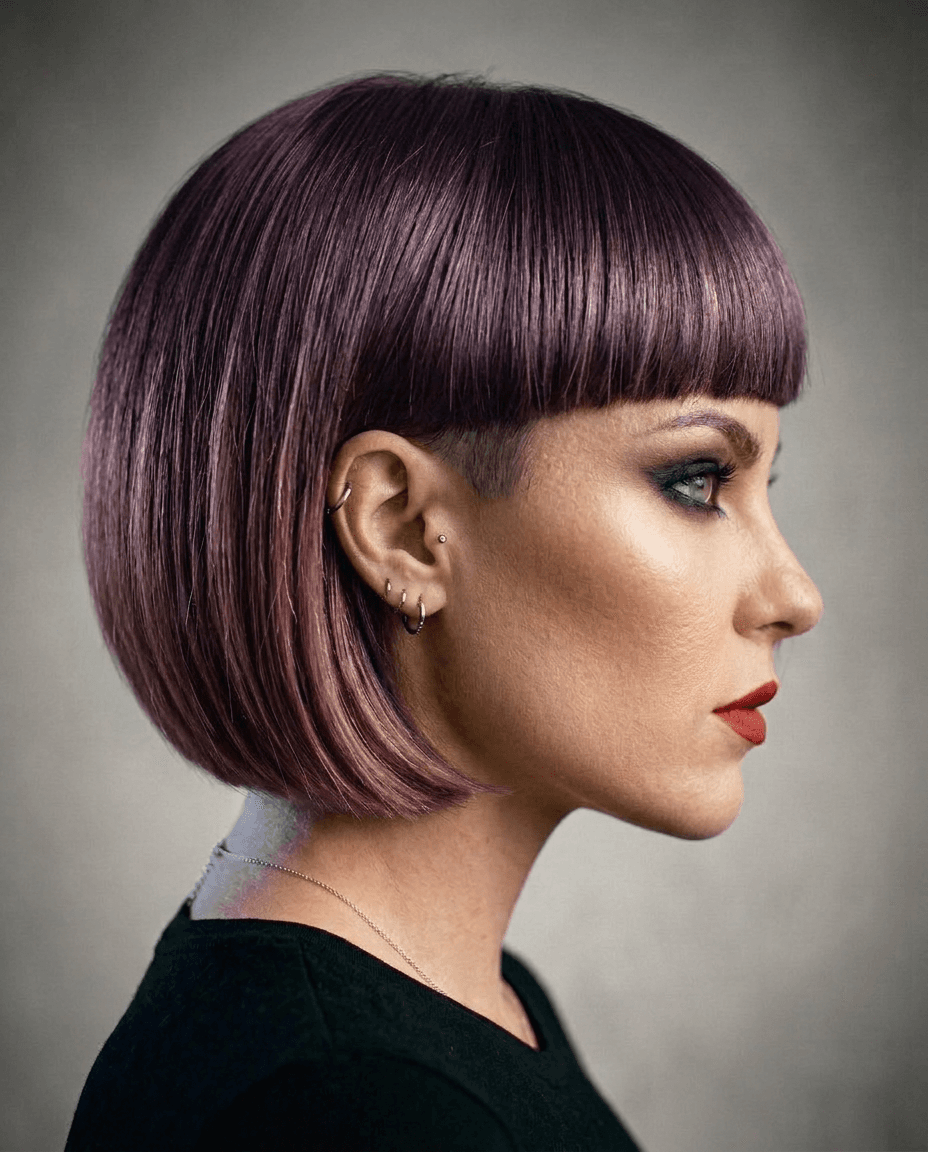French Bob, violet. Chin length with a heavy blunt fringe, taken somewhere you would never risk.